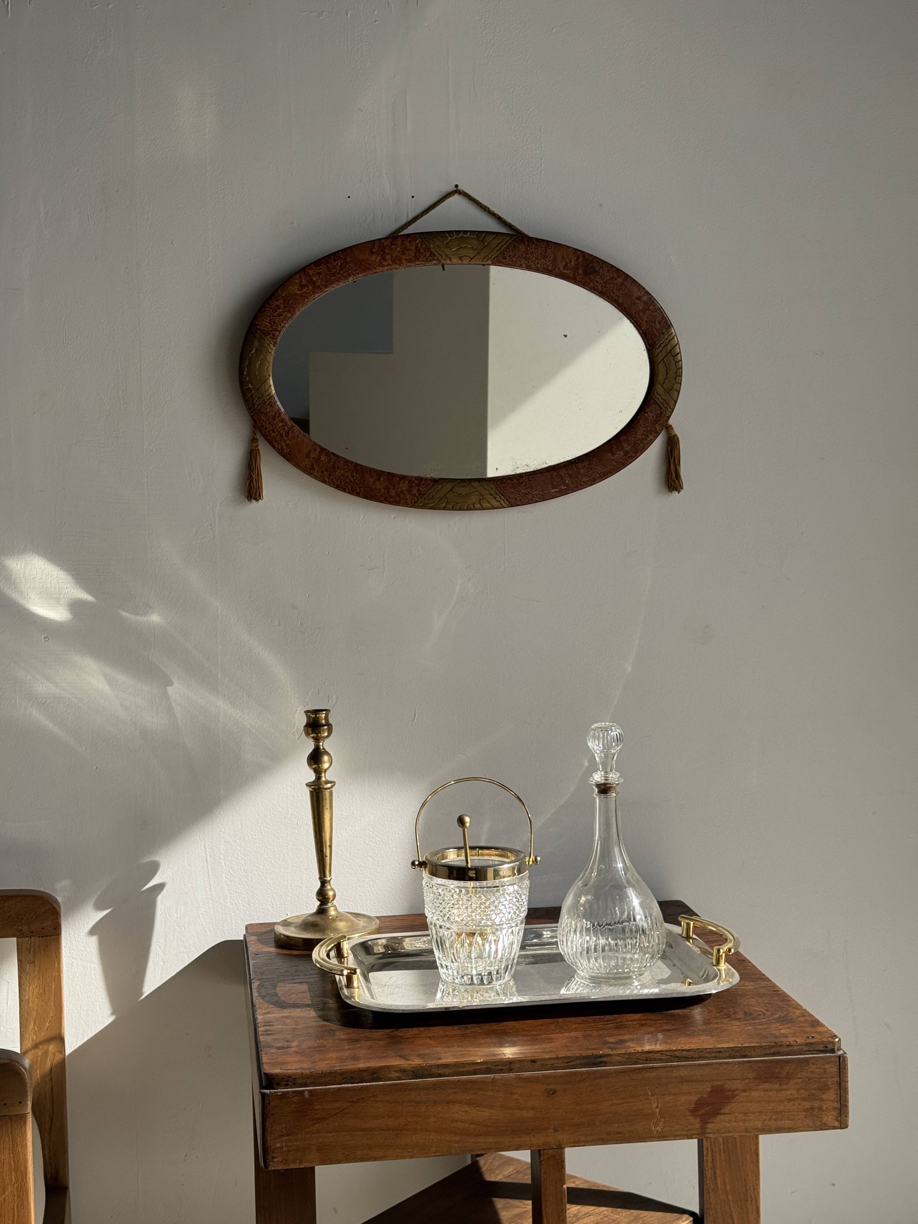 Small oval Art Deco mirror in brown and gold 33x54.