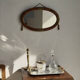 Small oval Art Deco mirror in brown and gold 33x54.