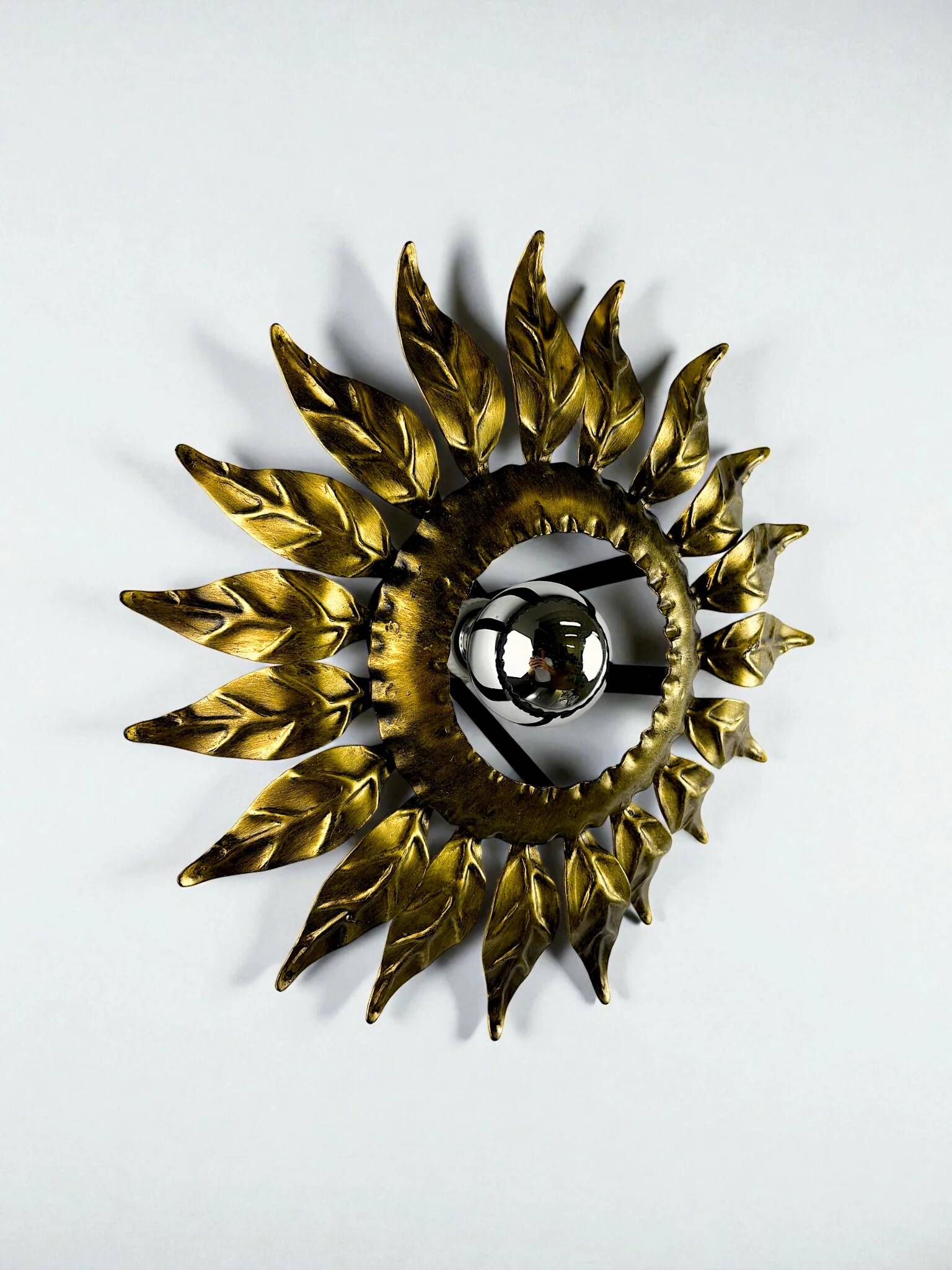 Sunburst ceiling light fixture or sconce in gilt wrought iron, Spain, circa 1960s