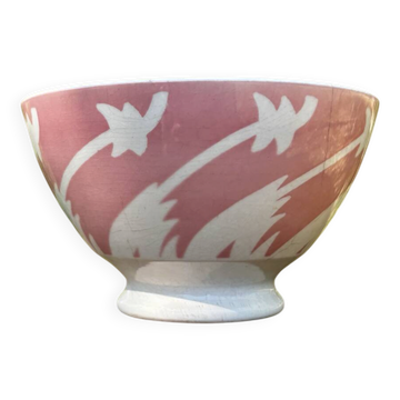 Old footed bowl in earthenware with pink decoration and defects.