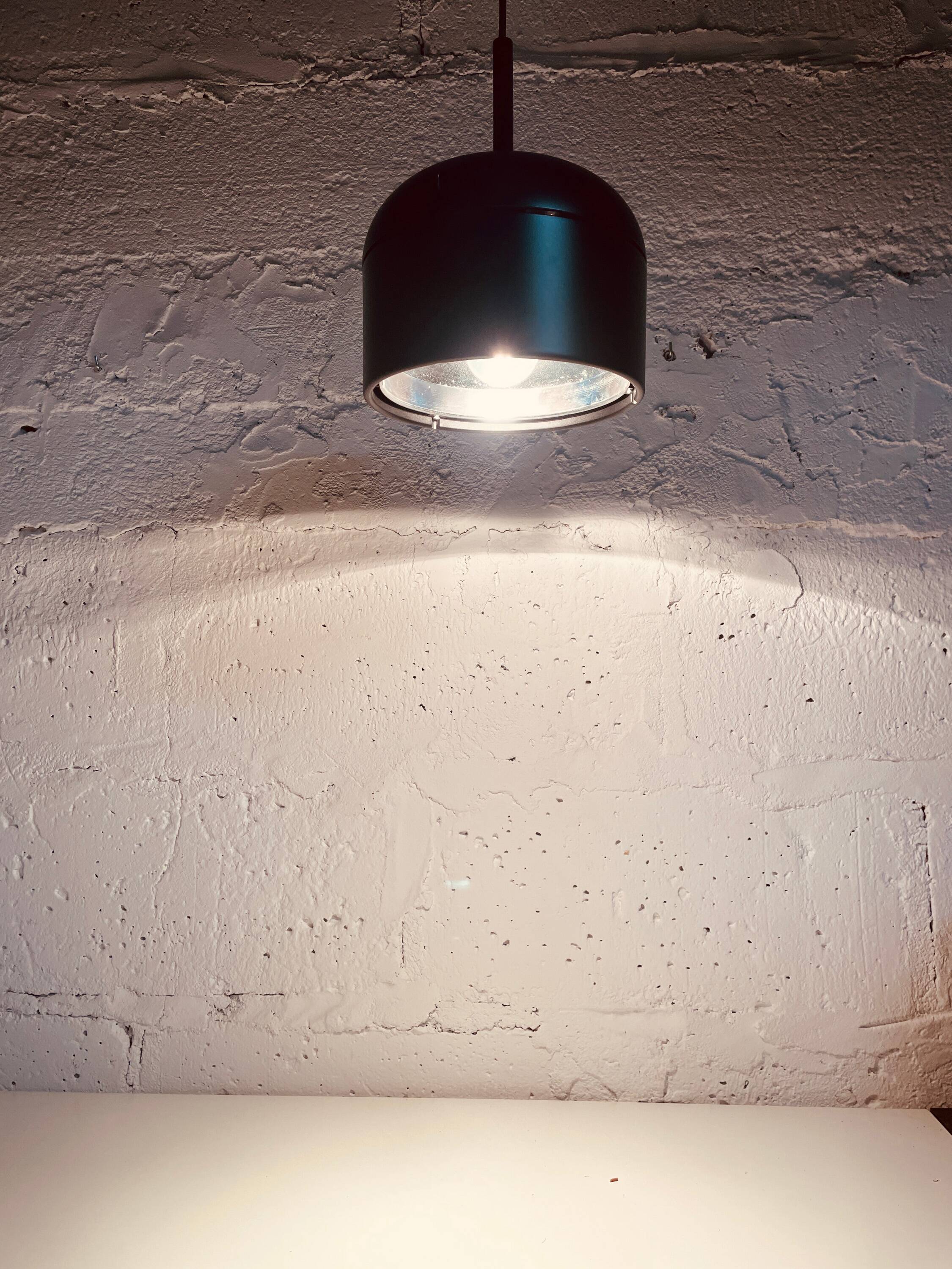 Black pendant lamp designed by Arnold Berges for Staff Leuchten, 1970.