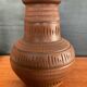 Trio of vintage vases in chiselled terracotta
