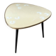 Tripod coffee table with floral design from the 1950s in brass metal and decorative top.