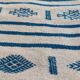 Traditional handmade white and blue kilim rug in natural wool