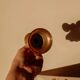 Brass candlestick in the shape of a bell.