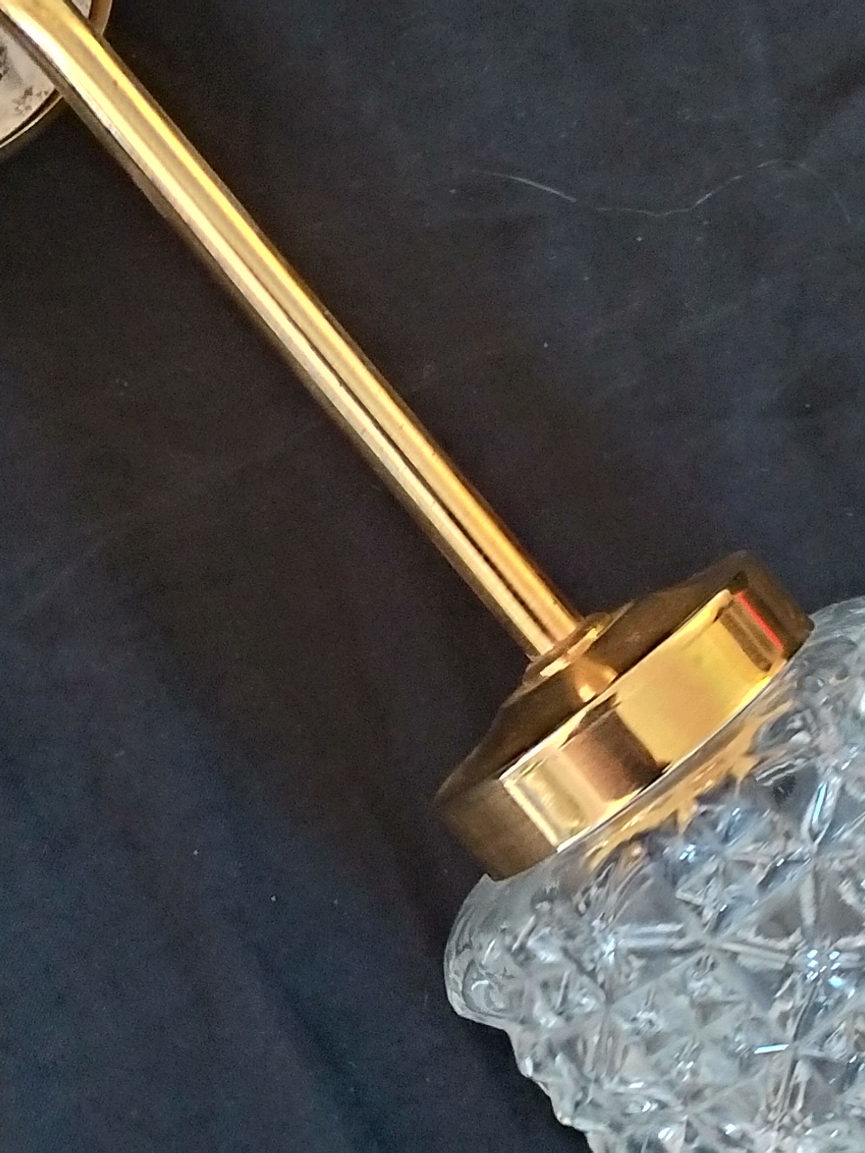 3-spoke brass chandelier and chissed glass