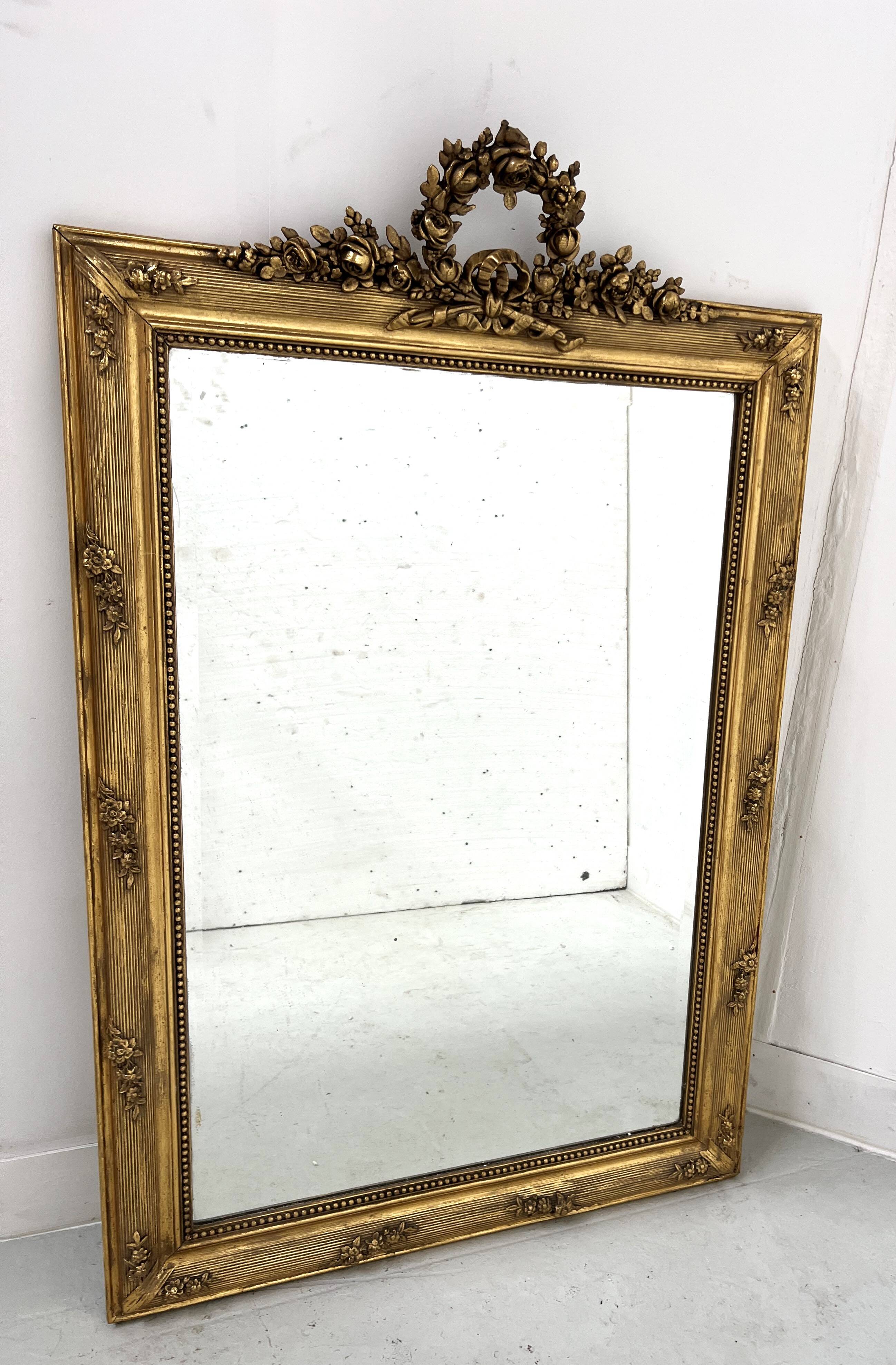 Louis XVI style mirror in wood and gilded stucco, 19th century