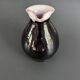 Antique black pitcher with white collar