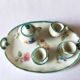 Small antique tea set in porcelain for children.