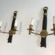 Pair of Black Lacquered Bronze Wall Lamps with Lions' Head Decorations. Around 1970