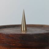 Vintage candle holder in an organic shape with a brass spike and tiered top.