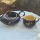 Teapot and milk jug We Two in vintage black and yellow ceramic