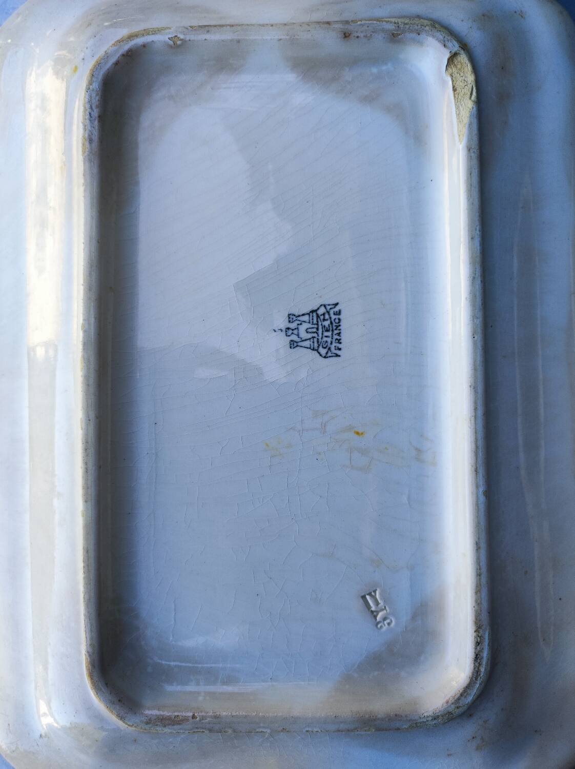 2 old earthenware dishes, one from Gien