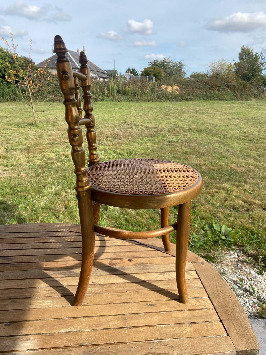 Children's chair in cane and curved wood