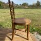 Children's chair in cane and curved wood