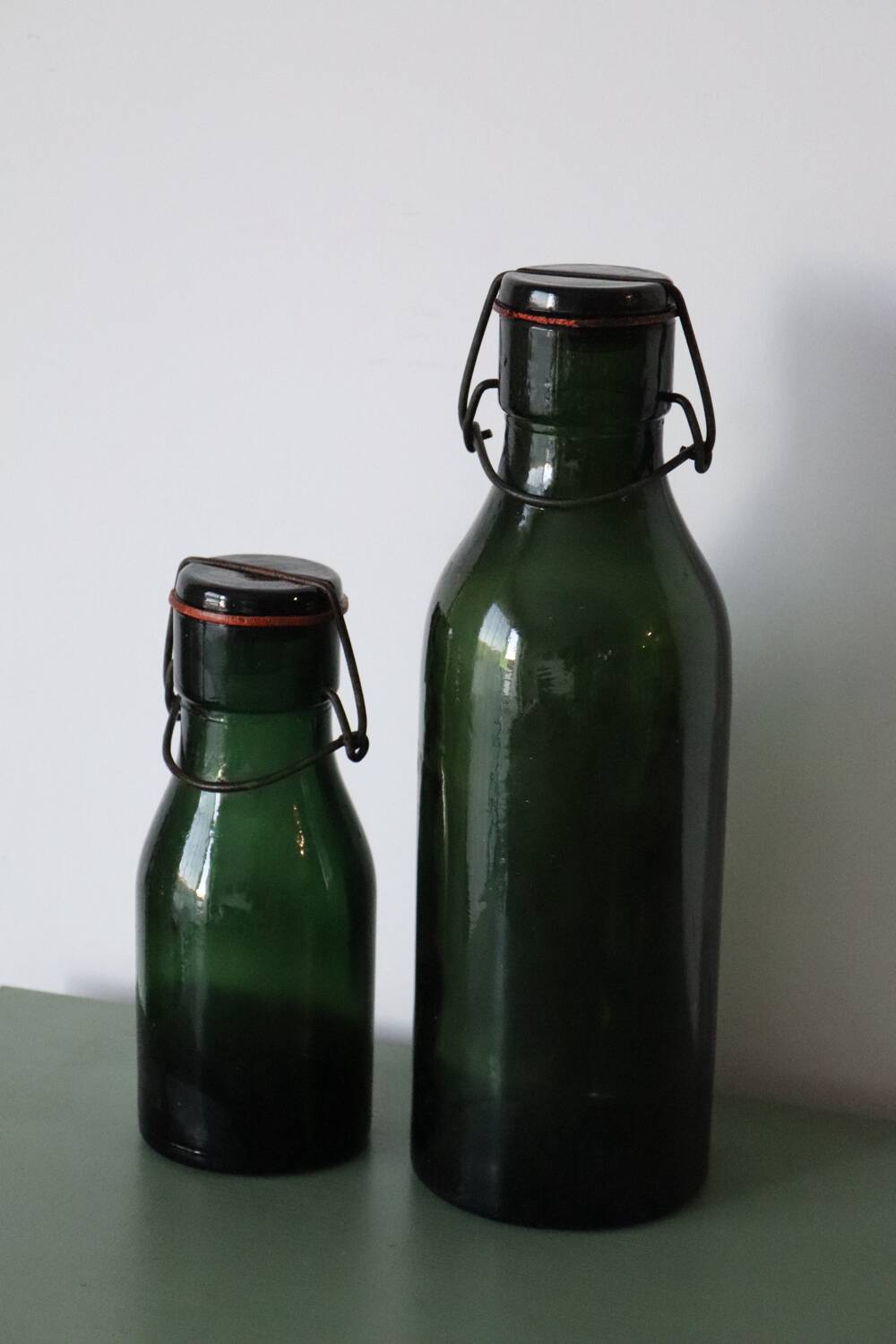 Pair of old green glass jars/bottles – models 1/2 and 1 1/