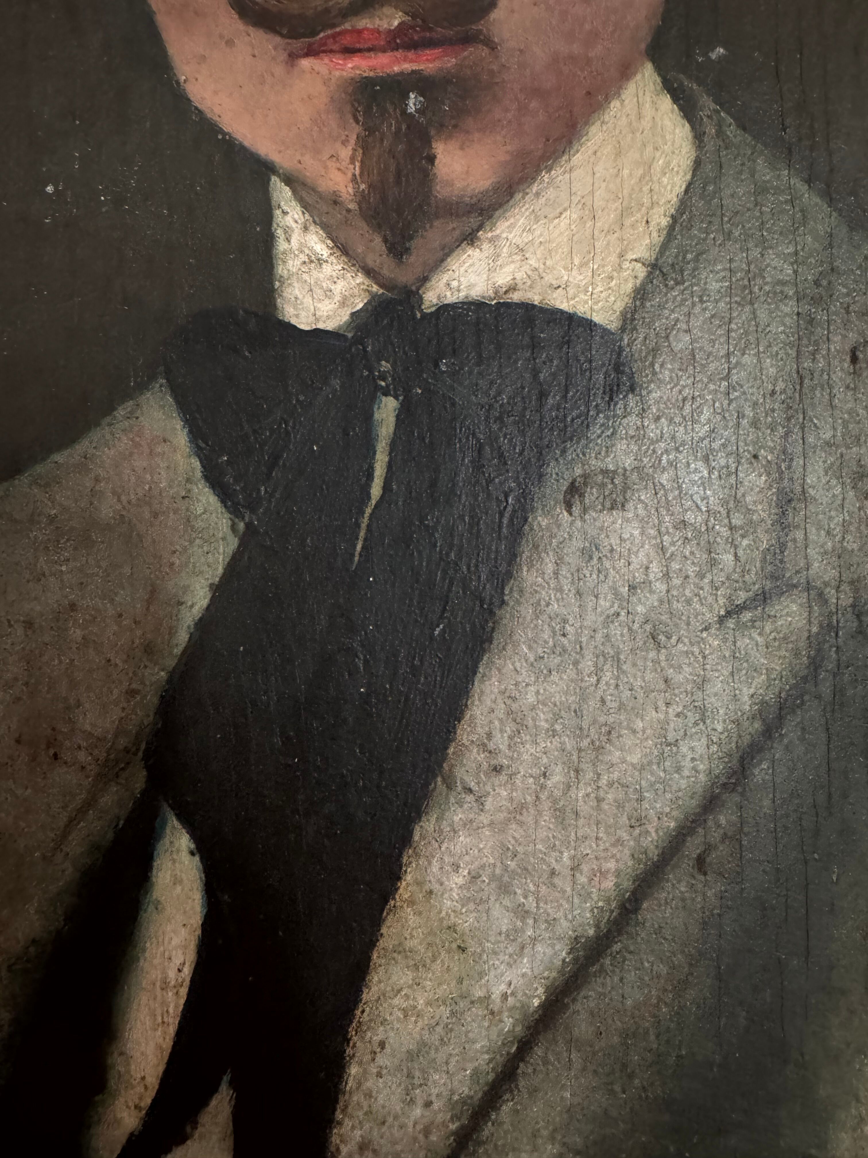 Portrait of a dandy with a moustache from the early 20th century.