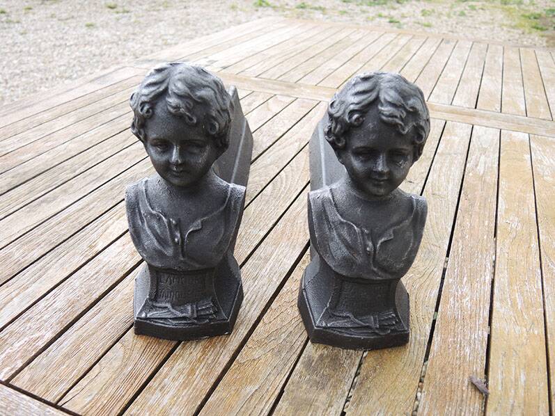 Antique cast iron fireplace andirons: bust of a garçonne