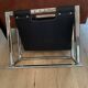 Chrome metal and leather magazine rack