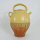 Old jug, chevrette, water pitcher in glazed yellow sandstone. Early twentieth century