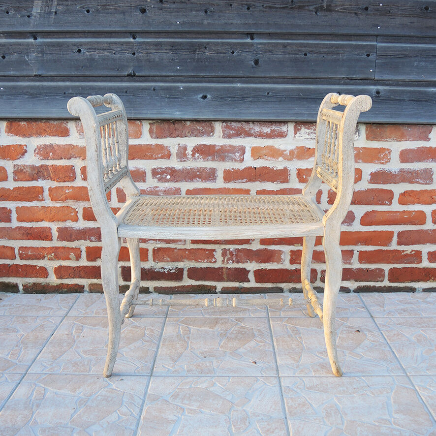 Antique Napoleon III piano bench in wood and cane.