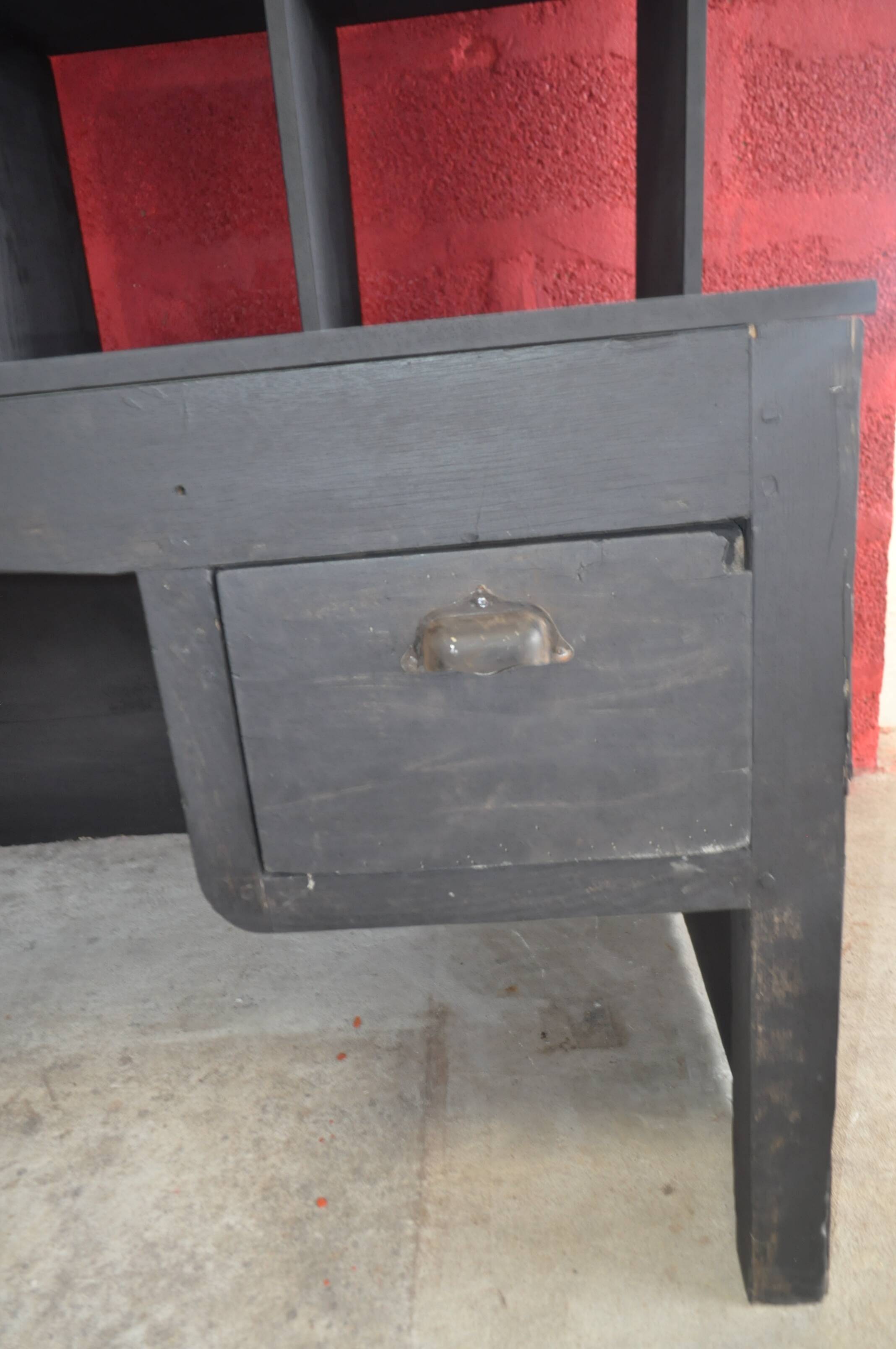 Wooden postal sorting desk.