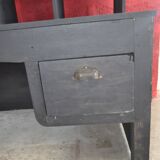 Wooden postal sorting desk.
