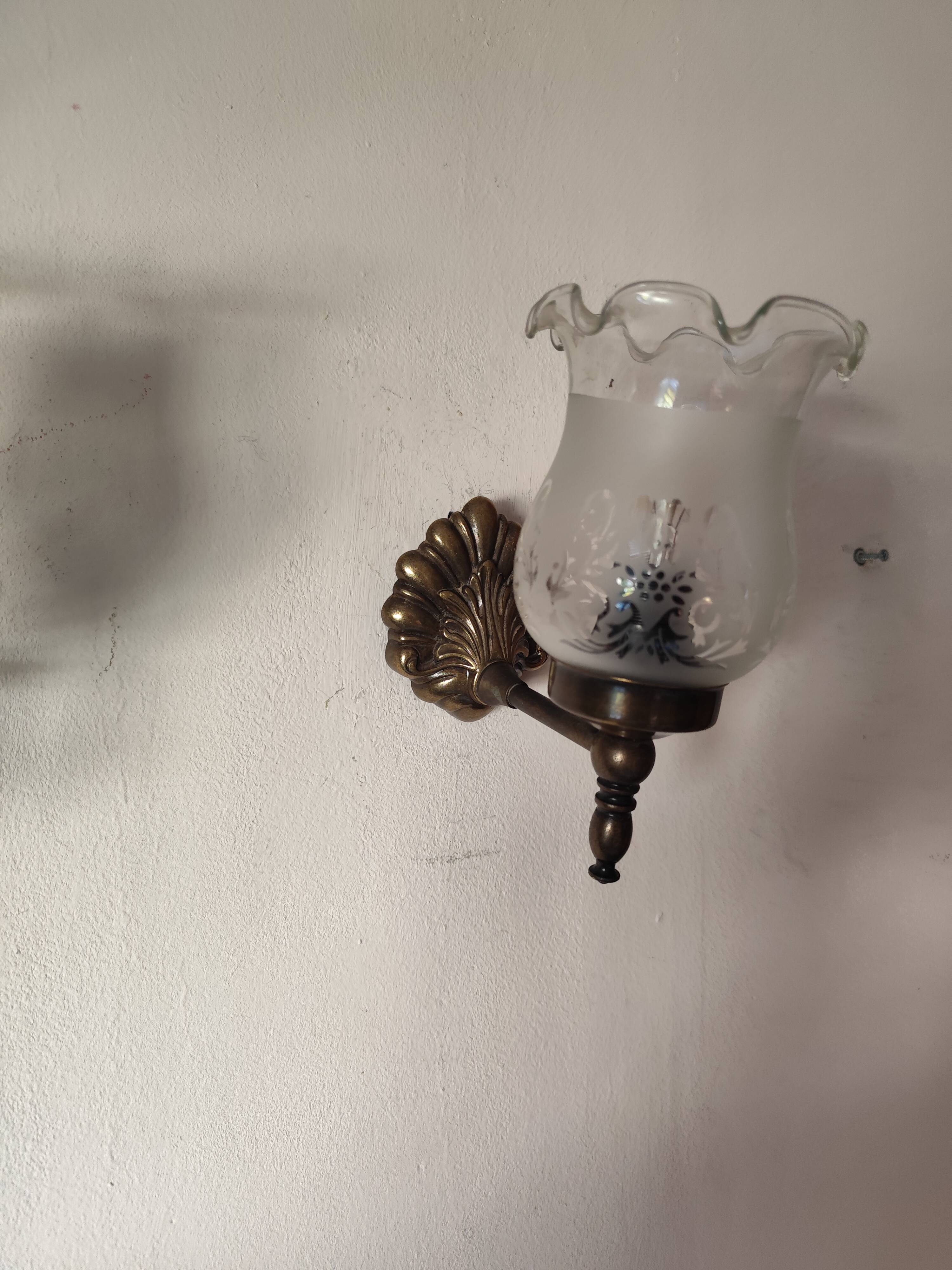 Pair of wall sconces in bronze with opaline glass tulips.