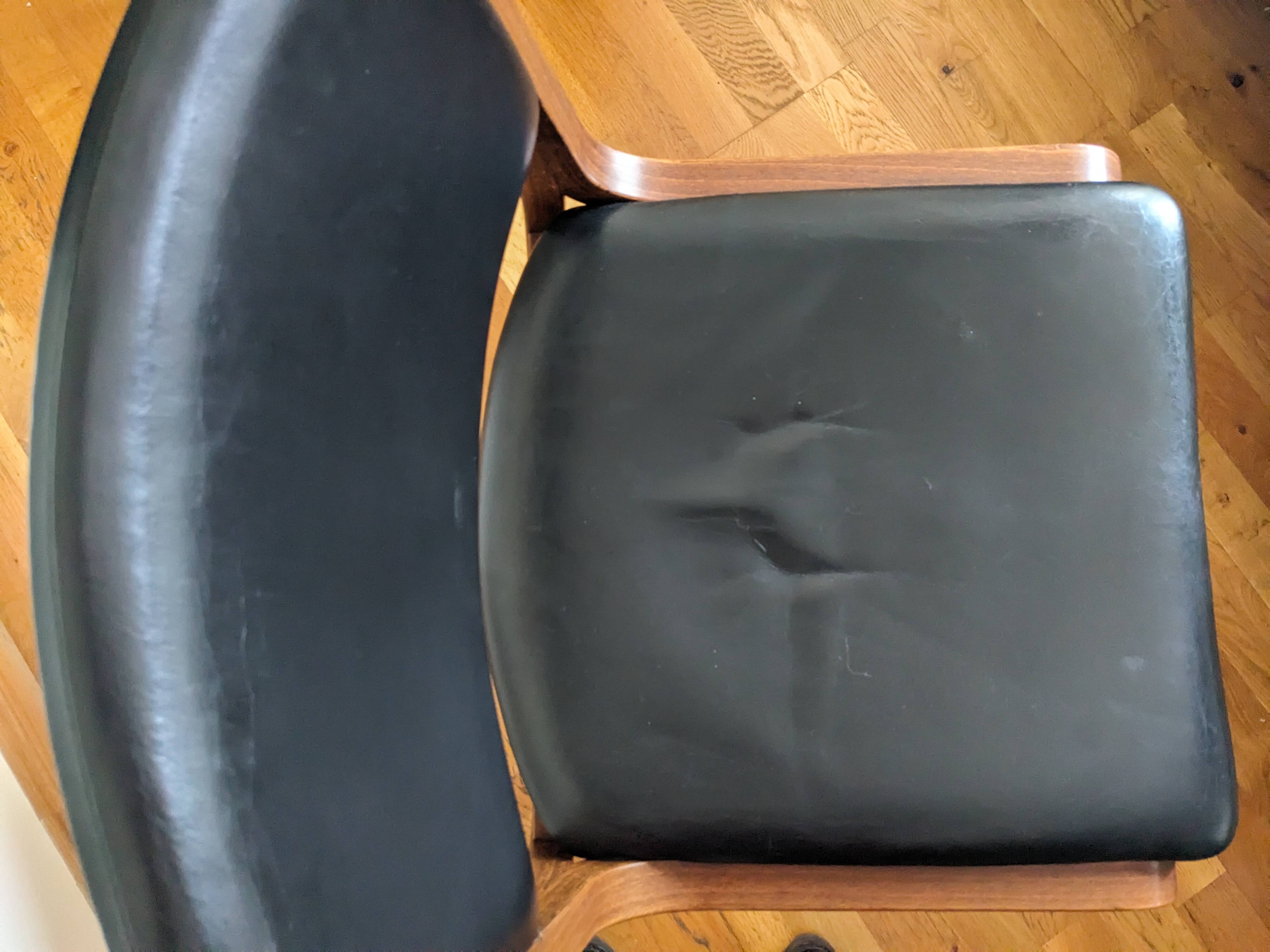 Vintage leather and wood chair pair