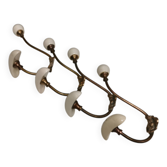 Coat hooks made of brass and raw white porcelain