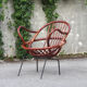 Rattan shell armchair with metal feet