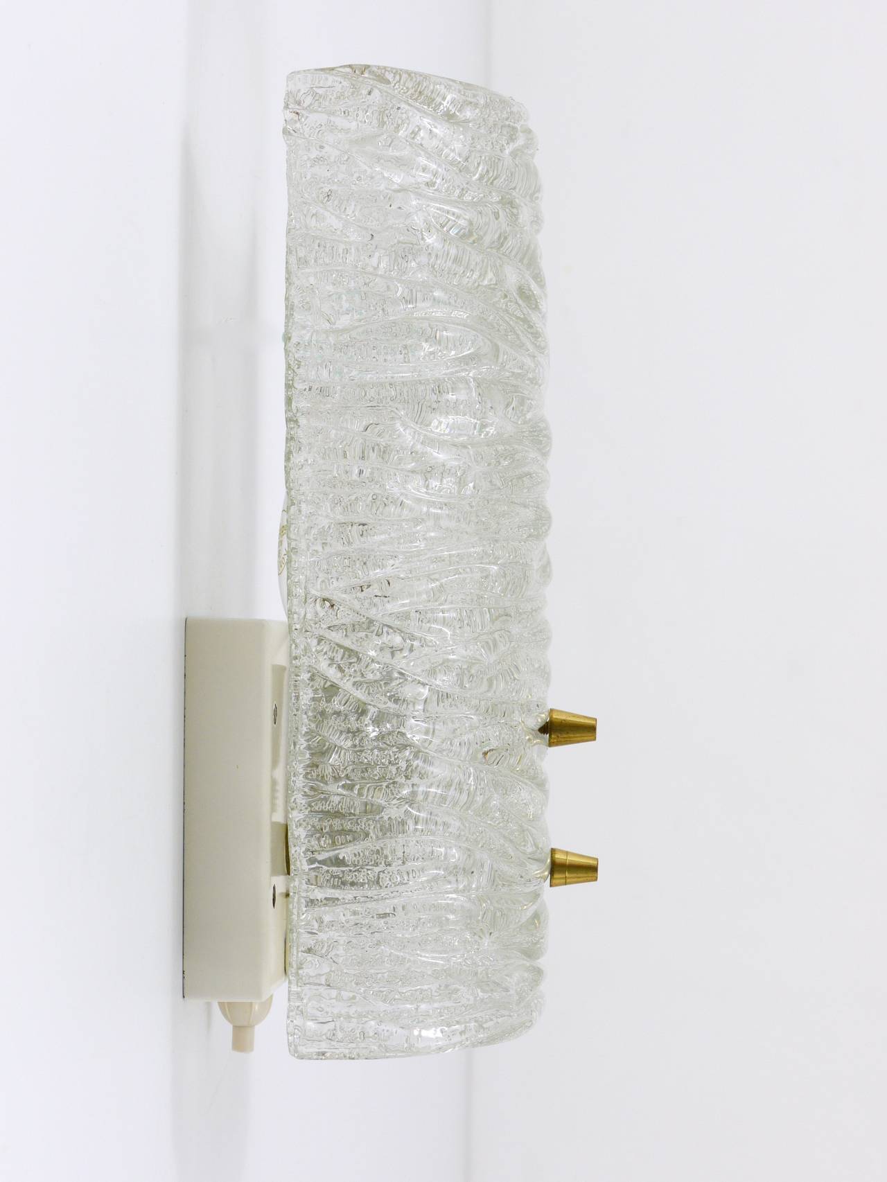 Pair of wall sconces by J.T. Kalmar, brass and textured glass, Austria, 1950s.