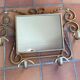 Wall-mounted gilded wrought iron coat rack with mirror