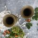 Pair of embossed brass bud vases stamped 17 cm