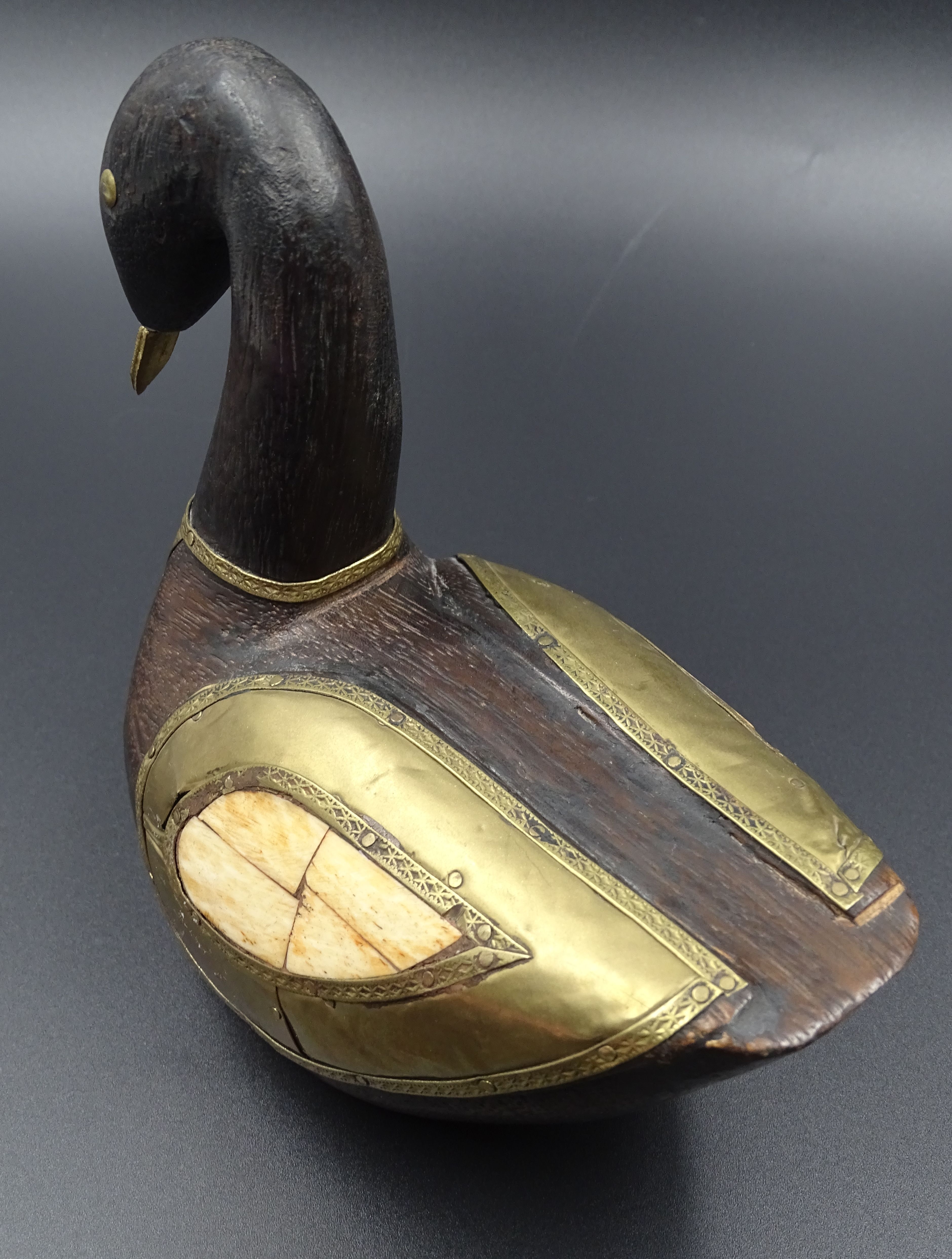 Wooden and brass swan