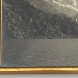Photo in black and white mountain lake in golden frame