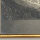 Photo in black and white mountain lake in golden frame