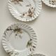 Haviland service, plates, pedestal dishes and soup tureen.