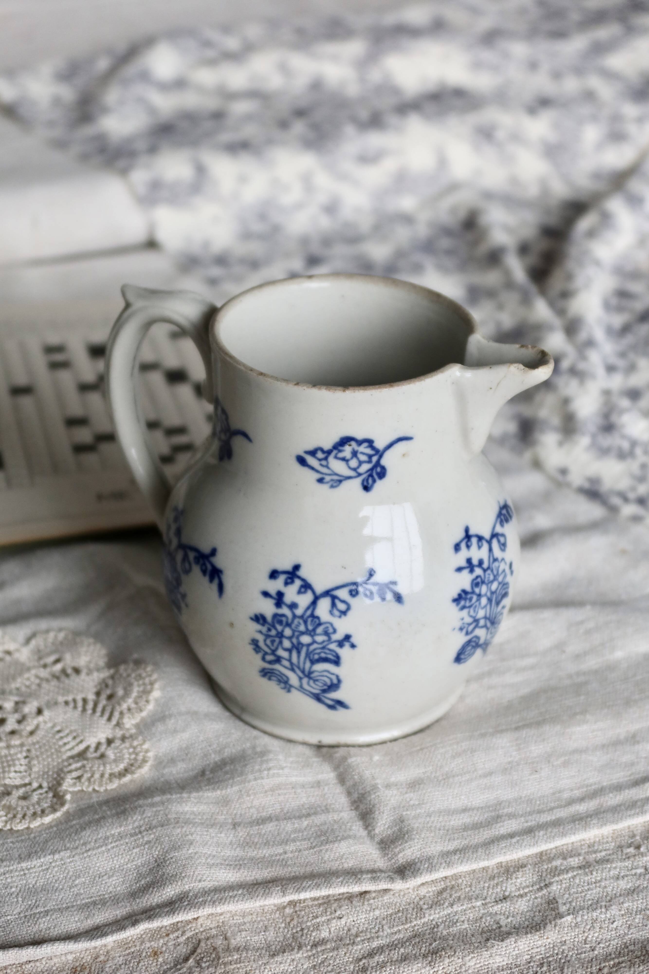 Antique Saint-Uze steel clay pitcher with cobalt blue floral pattern