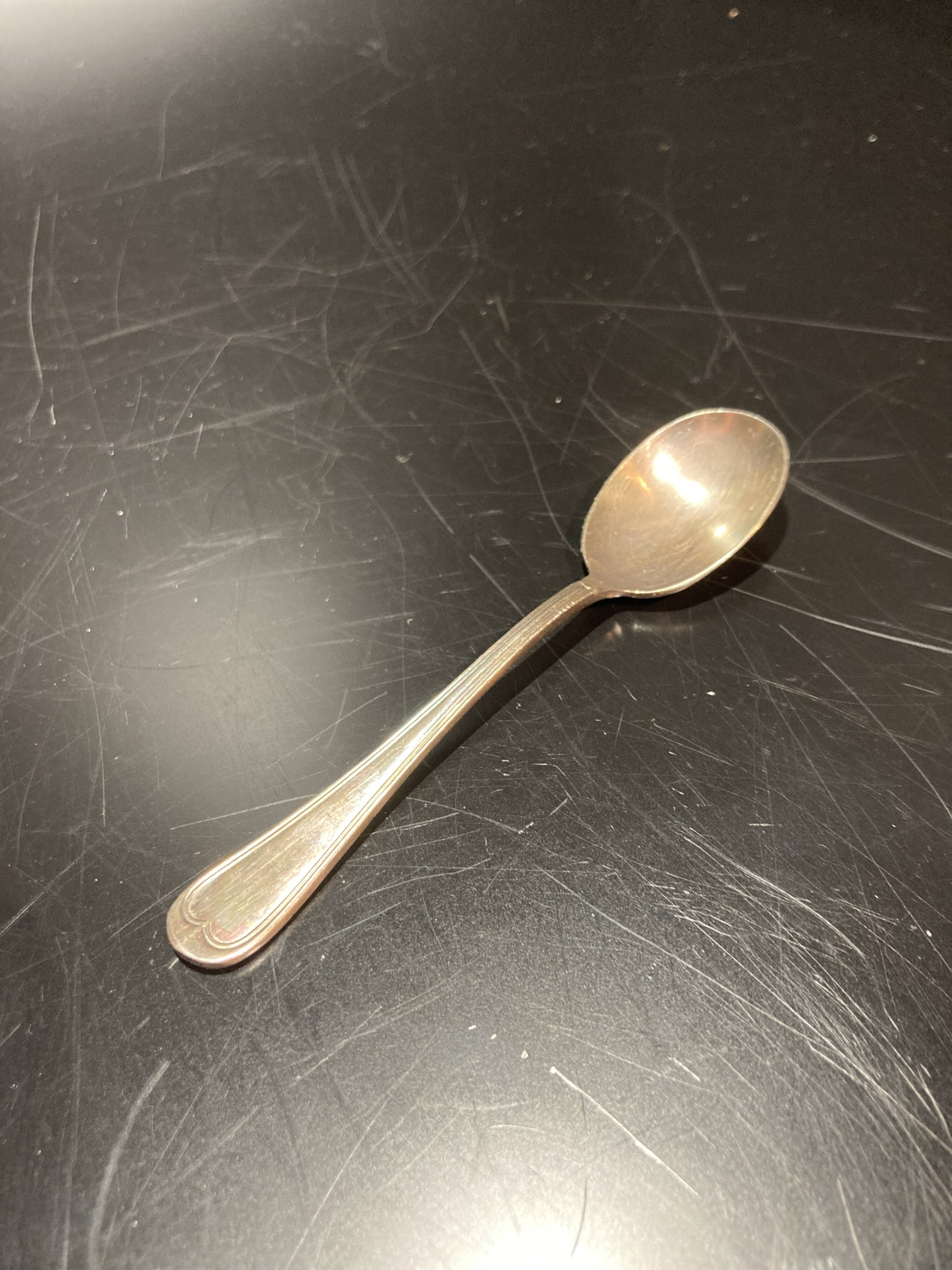 Egg cup with silver metal spoon