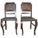 Pair of brown embossed leather chairs with brass studs and wooden frame, 1900s