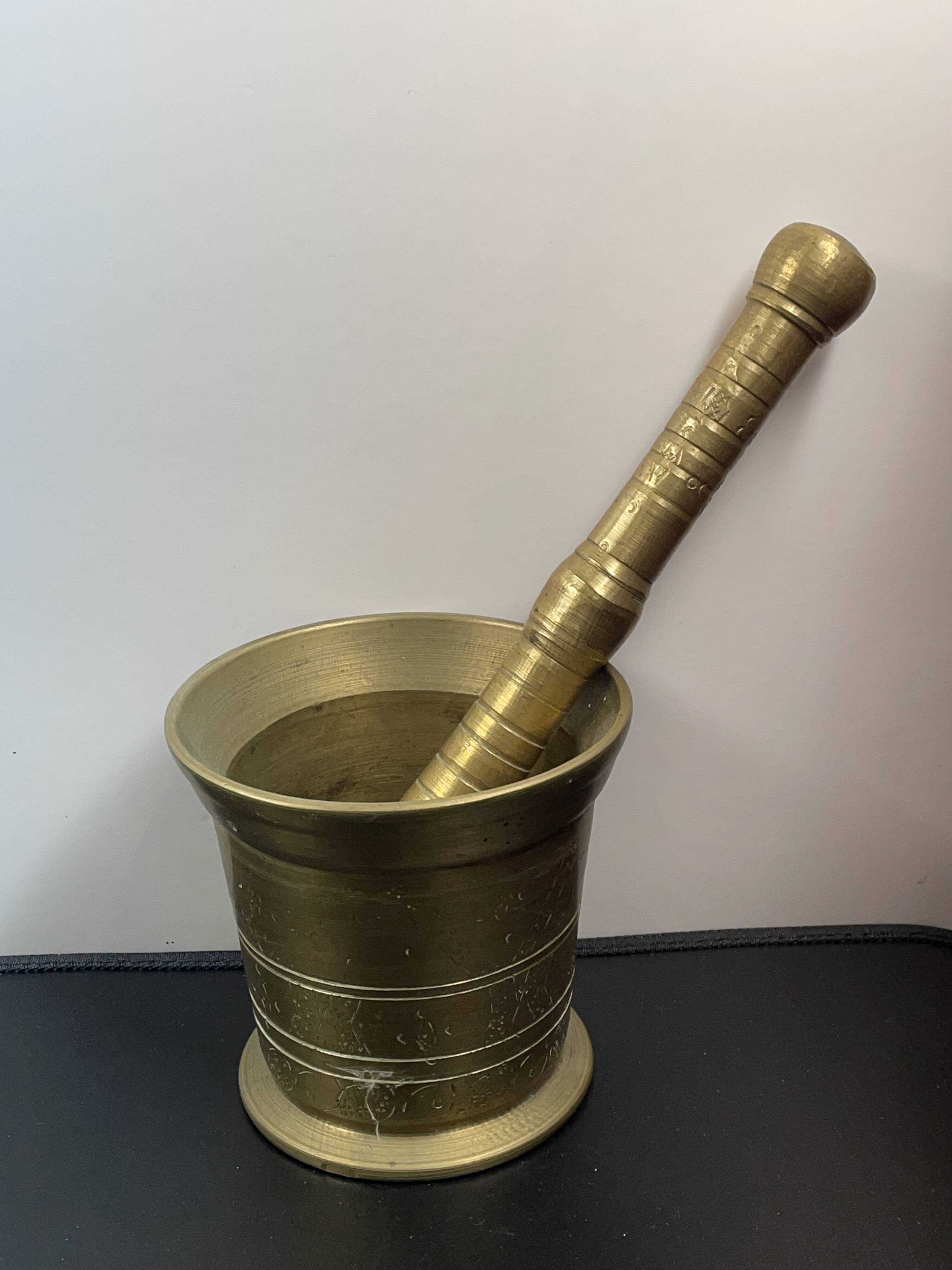 Large mortar & pestle. Chiseled bronze or brass metal, scarified decoration