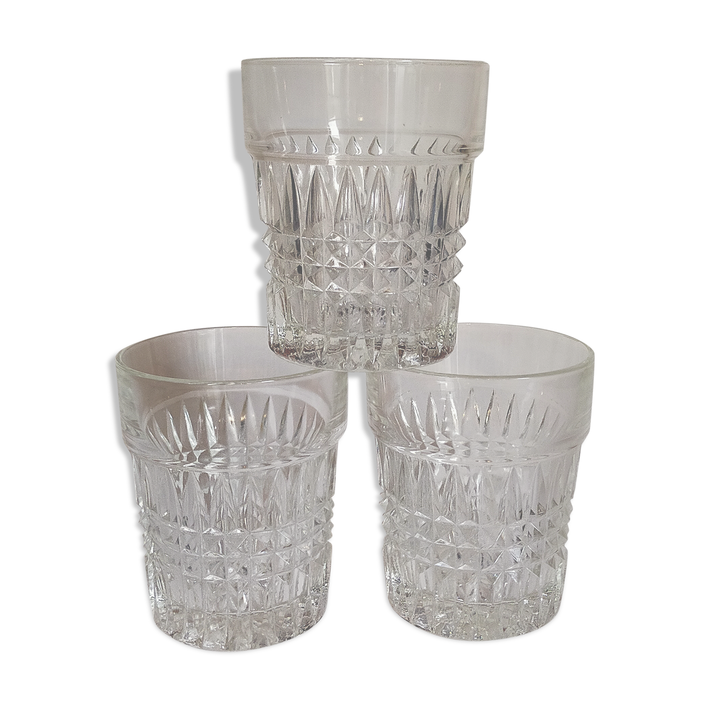 Trio of vintage whiskey glasses in pimpled glass