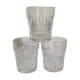 Trio of vintage whiskey glasses in pimpled glass