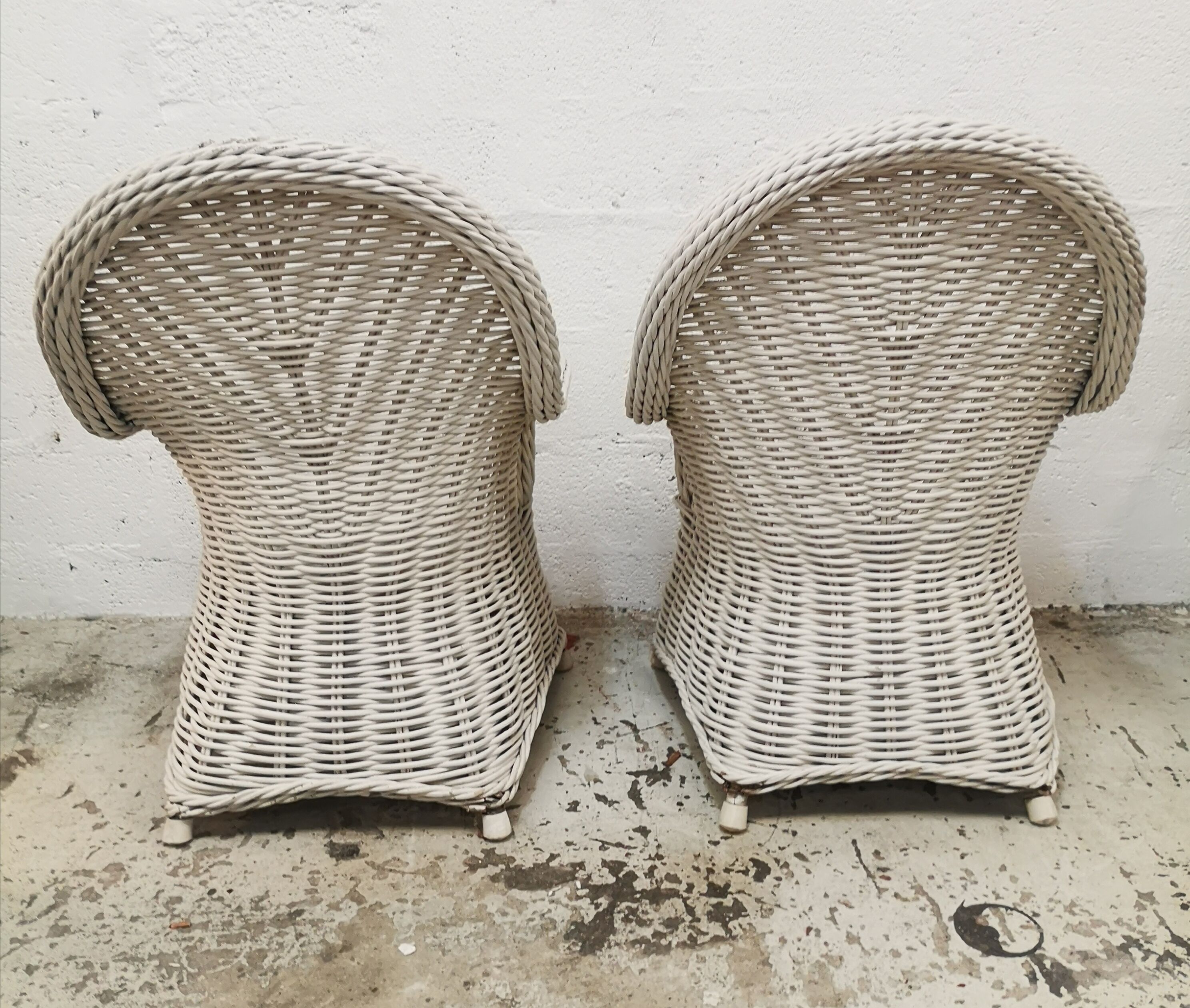Pair of white rattan armchairs