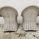 Pair of white rattan armchairs