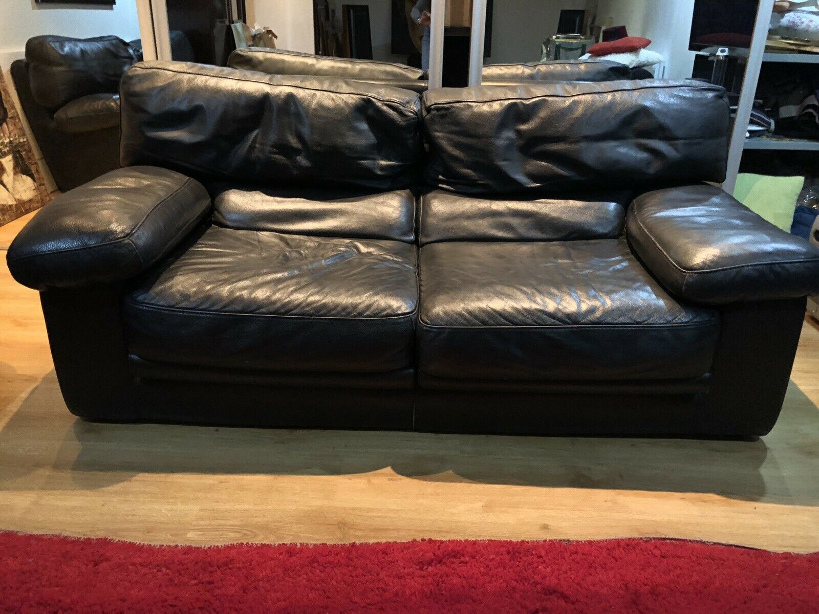 Pair of 2-seater sofas in black leather Roche & Bobois