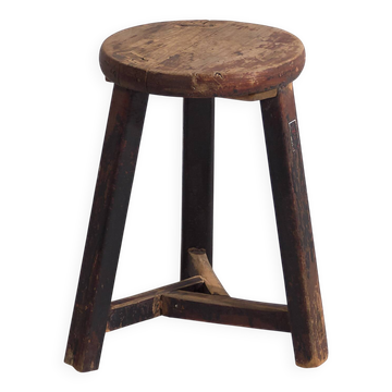 Old round stool in dark colour (c.1900)