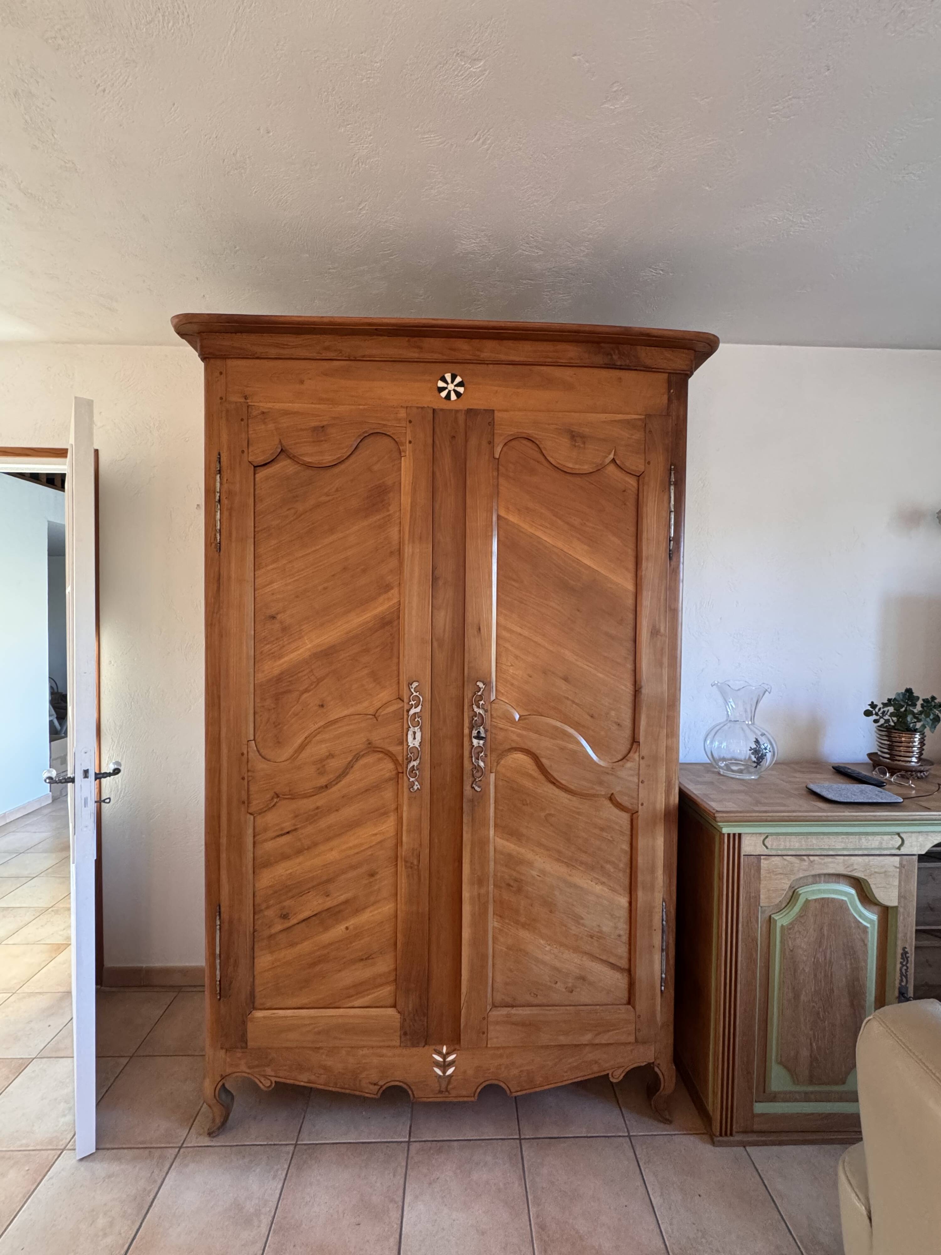 Antique 2-door wardrobe made of solid wood with shelves and drawers.