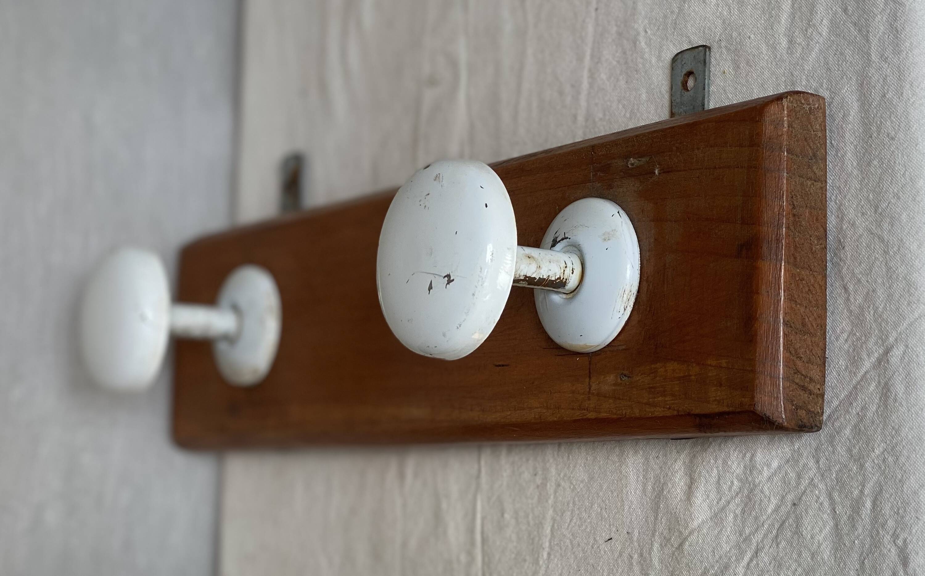 Wall-mounted coat rack with 2 hooks, vintage 1960s white lacquered metal.